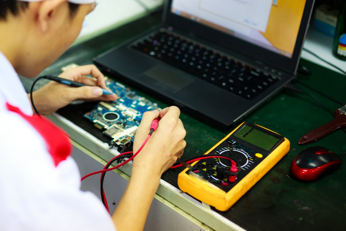 Veteran-owned I.T. technician repairing a laptop on-site